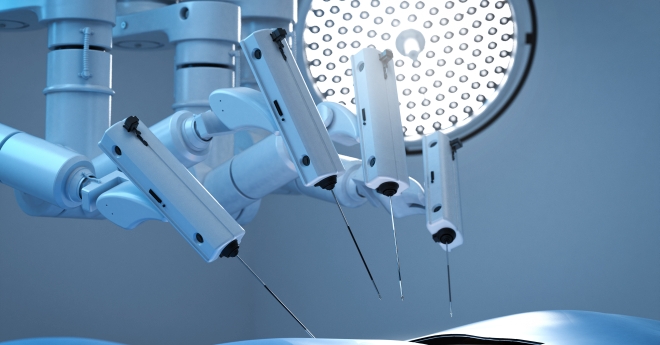 Surgical robot with multiple robotic arms under a surgical light
